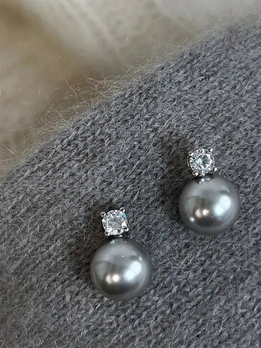 Boucles d'oreilles élégantes en perles noires avec zircon