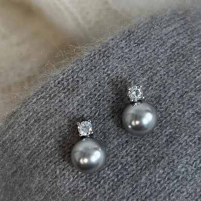 Boucles d'oreilles élégantes en perles noires avec zircon