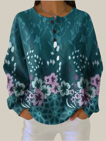 Nora - Pull couleur pétrole au design floral
