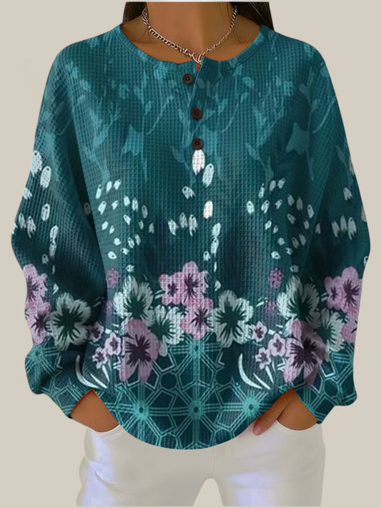 Nora - Pull couleur pétrole au design floral